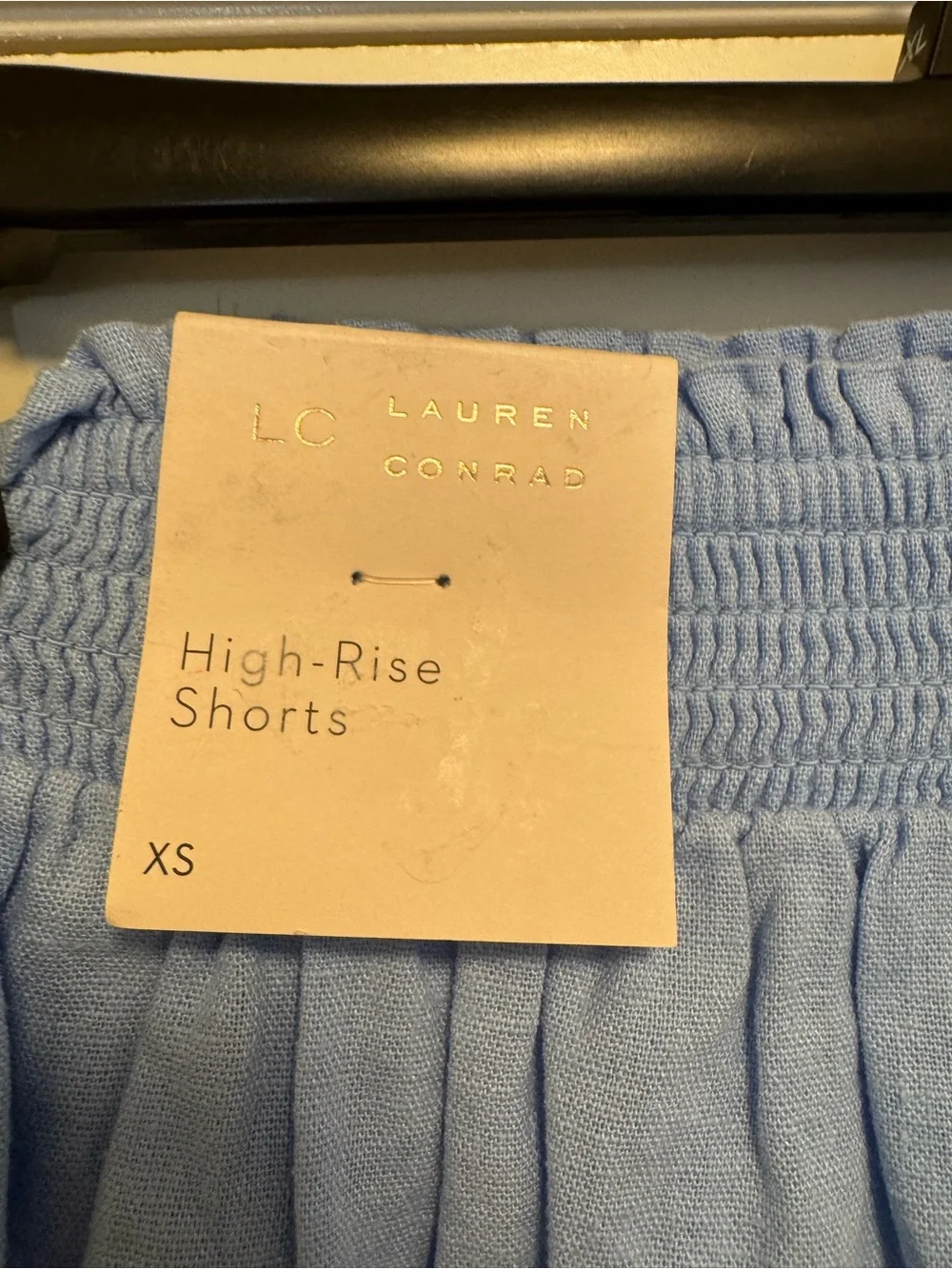 LC Lauren Conrad Super High Rise Smocked Scalloped Shorts in a light blue color